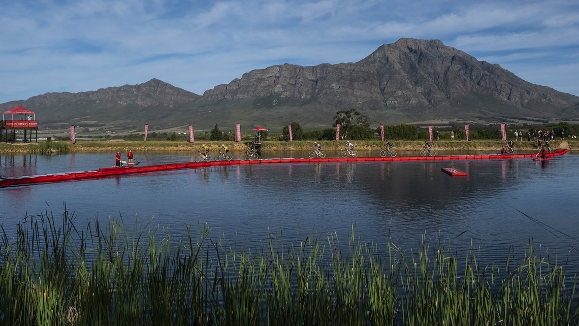 Riders head over the Thirsti bridge during Stage 1 of the 2024 Absa Cape Epic Mountain Bike stage race from Saronsberg Wine Estate to Saronsberg Wine Estate, Tulbagh, South Africa on the 18th March 2024. Photo by Dominic Barnardt / Cape Epic
PLEASE E