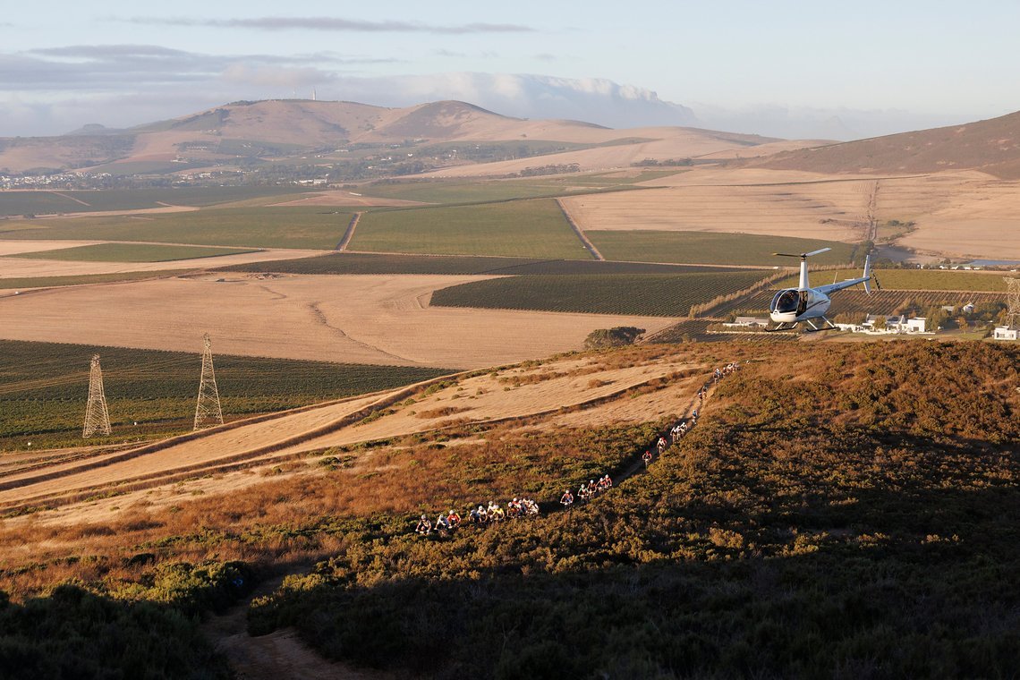 The lead bunch during Stage 1 of the 2025 Absa Cape Epic Mountain Bike stage race held at Meerendal Wine Estate, Cape Town, South Africa on the 17th March 2025. Photo by Nick Muzik/Cape Epic
PLEASE ENSURE THE APPROPRIATE CREDIT IS GIVEN TO THE PHOTOG