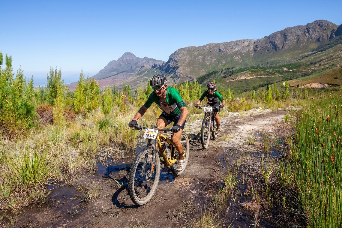 Mannie Heymans and Genevieve Weber during stage 1 of the 2022 Absa Cape Epic Mountain Bike stage race from Lourensford Wine
Estate to Lourensford Wine Estate, South Africa on the 21st March 2022. Photo Sam Clark/Cape Epic