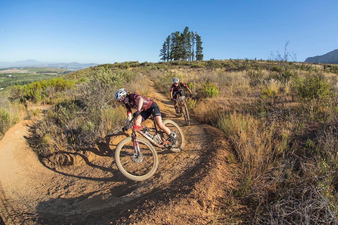 Haley Batten and Sofia Villafane during stage 1 of the 2022 Absa Cape Epic Mountain Bike stage race from Lourensford Wine Estate to Lourensford Wine Estate, South Africa on the 21st March 2022. © Dom Barnardt / Cape Epic