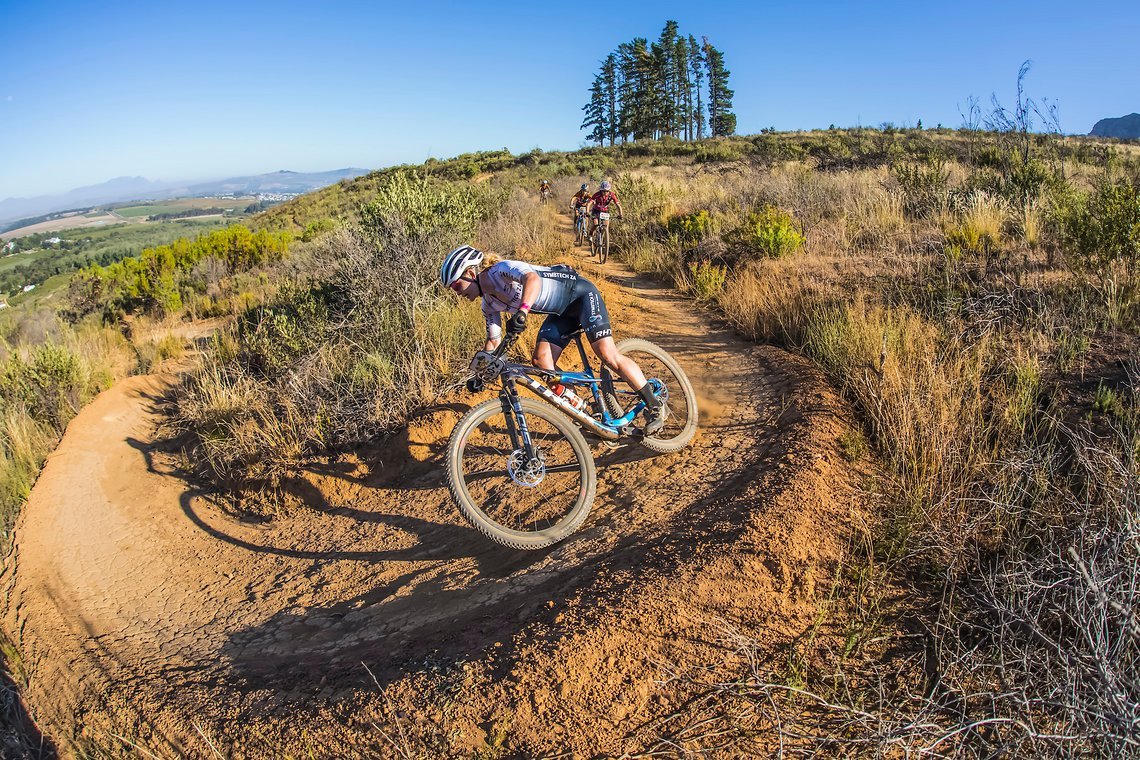 Amy Wakefield ahead of team nate Ariane Luthi and team of Pauline Ferrand Prevot and Robyn de Groot during stage 1 of the 2022 Absa Cape Epic Mountain Bike stage race from Lourensford Wine Estate to Lourensford Wine Estate, South Africa on the 21st M