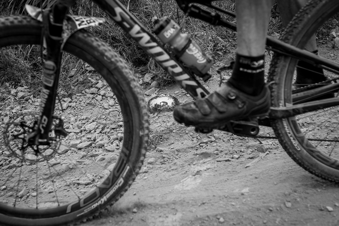 A reflection on a riders lens that fell off on the decent of Plum Pudding during the Prologue of the 2019 Absa Cape Epic Mountain Bike stage race held at the University of Cape Town in Cape Town, South Africa on the 17th March 2019.

Photo by Xavie