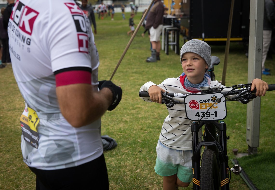 The son of Hermanus Francois Joubert with his dad's bike before the start of Prologue of the 2019 Absa Cape Epic Mountain Bike stage race held at the University of Cape Town in Cape Town, South Africa on the 17th March 2019.

Photo by Dwayne Senior