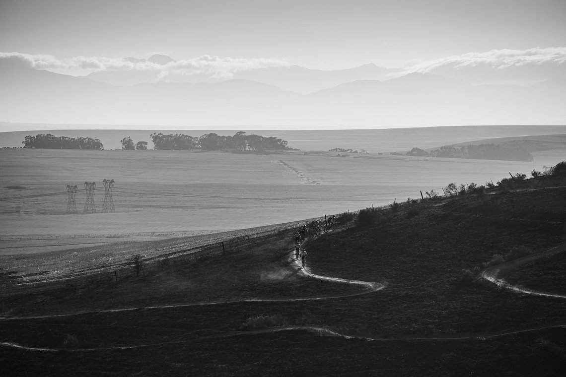 Elite riders head up a windy dusty climb during Stage 1 of the 2025 Absa Cape Epic Mountain Bike stage race held at Meerendal Wine Estate, Cape Town, South Africa on the 17th March 2025. Photo by Dom Barnardt/Cape Epic
PLEASE ENSURE THE APPROPRIATE C