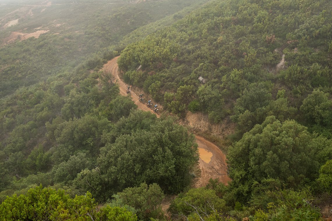 A group of riders winding their way through the wet jeep tracks during the Prologue of the 2019 Absa Cape Epic Mountain Bike stage race held at the University of Cape Town in Cape Town, South Africa on the 17th March 2019.

Photo by Xavier Briel/Ca