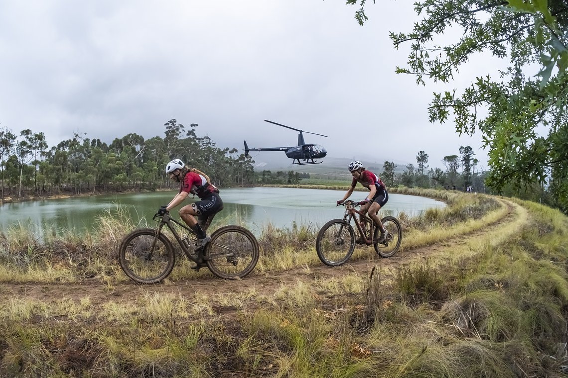 Hayley Preen and Bianca Haw during Stage 6 of the 2025 Absa Cape Epic Mountain Bike stage race held at Lourensford Wine Estate, Somerset West, Cape Town, South Africa on the 22nd March 2025. Photo by Dom Barnardt/Cape Epic
PLEASE ENSURE THE APPROPRIA