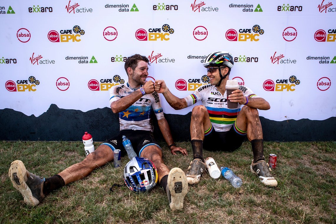 Lars Forster and Nino Schurter of SCOTT SRAM celebrate regaining the yellow jersey during stage 5 of the 2019 Absa Cape Epic Mountain Bike stage race held from Oak Valley Estate in Elgin to the University of Stellenbosch Sports Fields in Stellenbosch