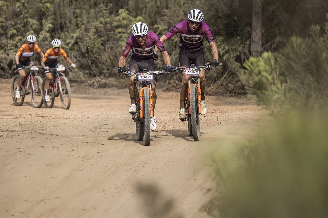 Ibon Zugasti and Kaare Aagaard with Elite lead ladies just behind them during Stage 4 of the 2025 Absa Cape Epic Mountain Bike stage race held at Fairview, Paarl, Cape Town, South Africa on the 20th March 2025. Photo by Dom Barnardt/Cape Epic
PLEASE 