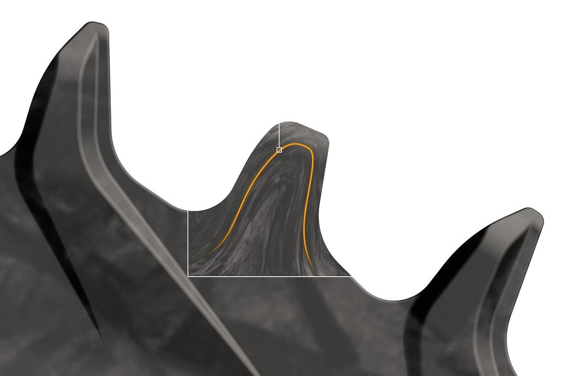 Durch ein spezielles Fertigungsverfahren sollen die Carbonfasern entlang der Zähne ausgerichtet sein, was Kraftübertragung und Standfestigkeit positiv beeinflussen soll.