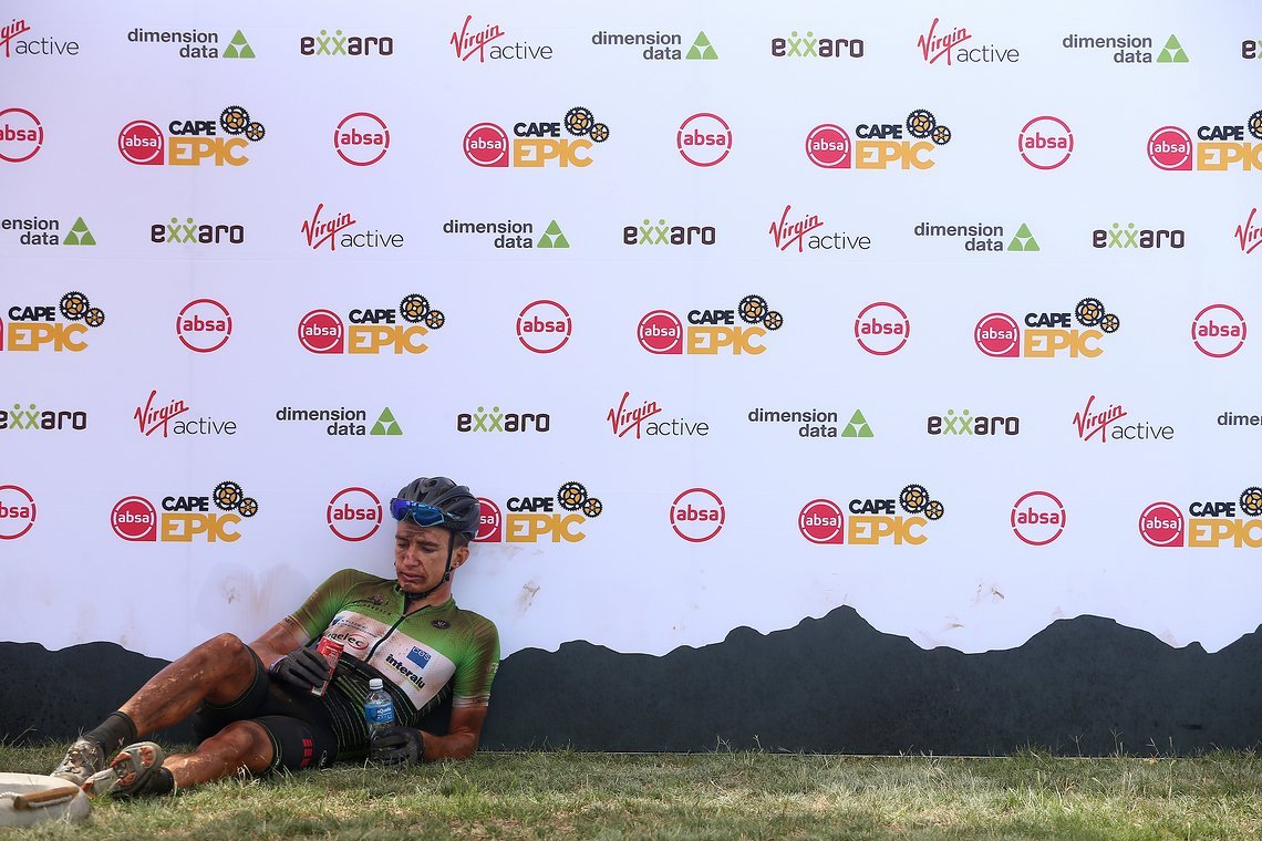 An exhausted Hendrik Kruger of Team Pro Devonbosch Qhubeka during stage 5 of the 2019 Absa Cape Epic Mountain Bike stage race held from Oak Valley Estate in Elgin to the University of Stellenbosch Sports Fields in Stellenbosch, South Africa on the 22