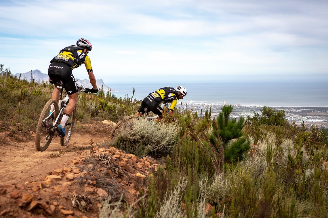 Manuel Fumic and Henrique Avancini of Cannondale Factory Racing chasing hard down Heldeberg Trails during stage 5 of the 2019 Absa Cape Epic Mountain Bike stage race held from Oak Valley Estate in Elgin to the University of Stellenbosch Sports Fields