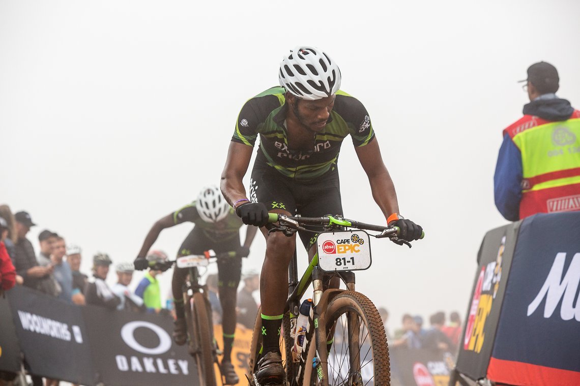 Sean Baloyi (front) and Anele Mtalana (rear) during the Prologue of the 2019 Absa Cape Epic Mountain Bike stage race held at the University of Cape Town in Cape Town, South Africa on the 17th March 2019.

Photo by Sam Clark/Cape Epic

PLEASE ENSU