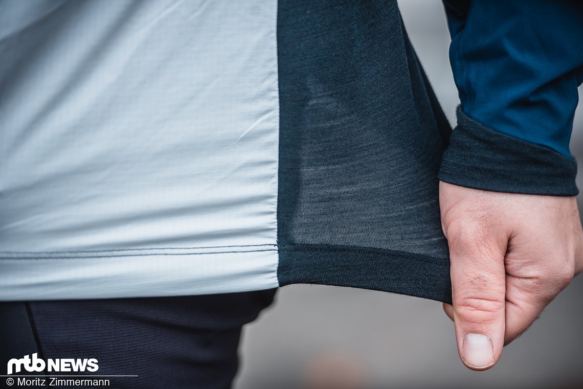 Hier sieht man gut den Übergang aus windfester Frontpartie und atmungsaktivem Rücken aus wärmendem Merino-Material