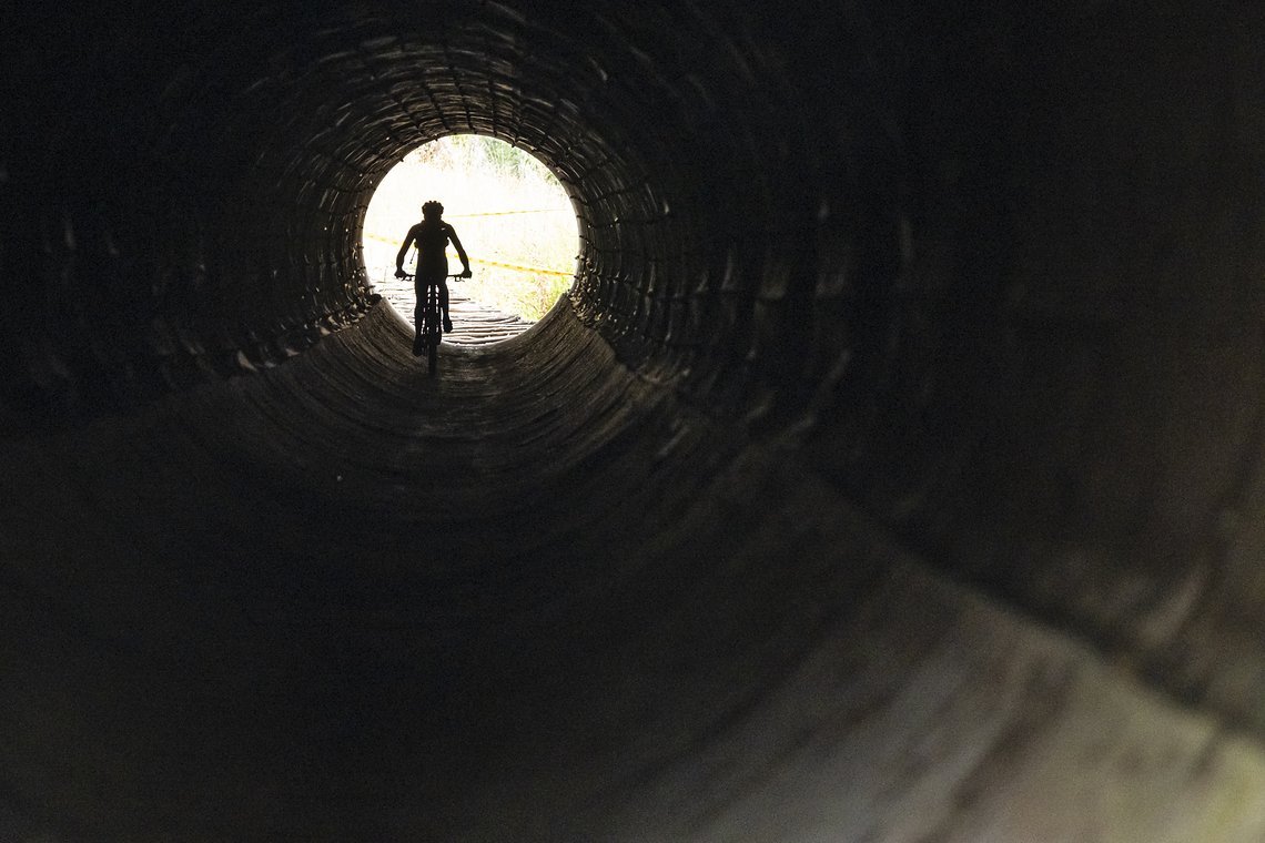 Rider heads through a long tunnel during Stage 5 of the 2025 Absa Cape Epic Mountain Bike stage race held from Fairview, Paarl, to Lourensford Wine Estate, Somerset West, Cape Town, South Africa on the 21st March 2025. Photo by Dom Barnardt/Cape Epic