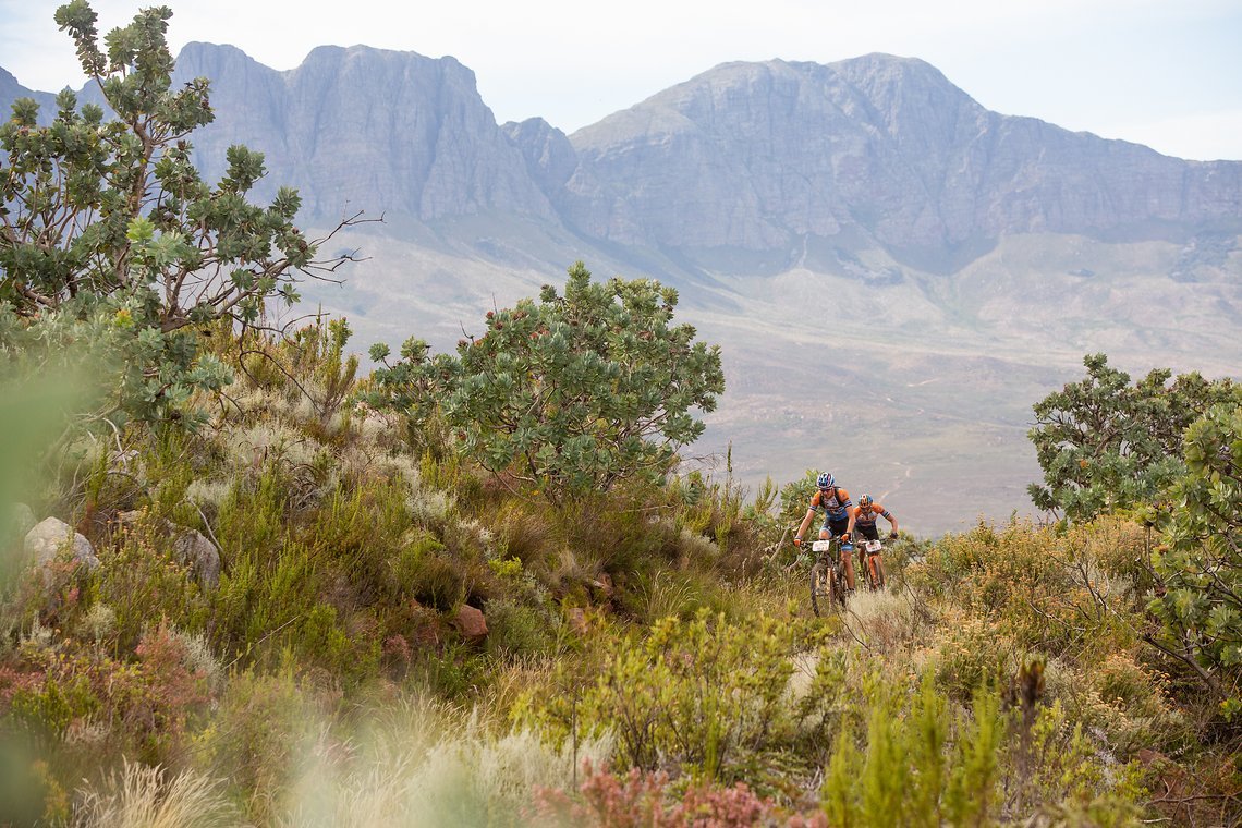 Erwin Bakker and David Nordemann during stage 5 of the 2019 Absa Cape Epic Mountain Bike stage race held from Oak Valley Estate in Elgin to the University of Stellenbosch Sports Fields in Stellenbosch, South Africa on the 22nd March 2019.

Photo by