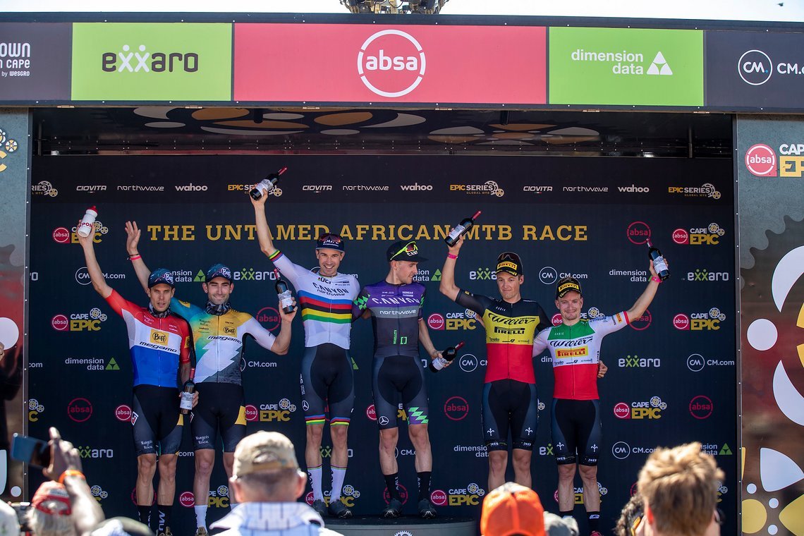 Mens Podium (L to R) Hans Becking and Jose Dias of BUFF-MEGAMO (2nd), Andreas Seewald and Martin Stosek of Canyon Northwave MTB (1st) and Wout Alleman and and Fabian Rabensteiner of Wilier Pirelli (3rd) during stage 1 of the 2022 Absa Cape Epic Mount