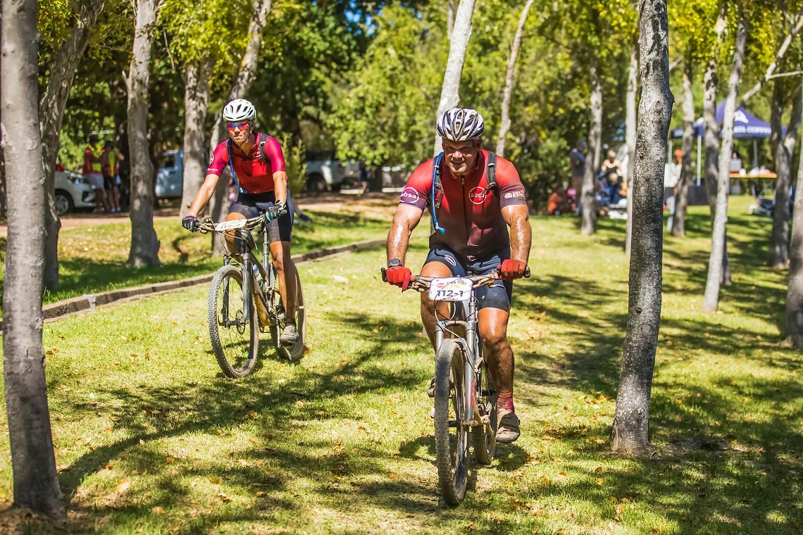 Marius Hurter and Adele Heelie during stage 1 of the 2022 Absa Cape Epic Mountain Bike stage race from Lourensford Wine Estate to Lourensford Wine Estate, South Africa on the 21st March 2022. © Dom Barnardt / Cape Epic