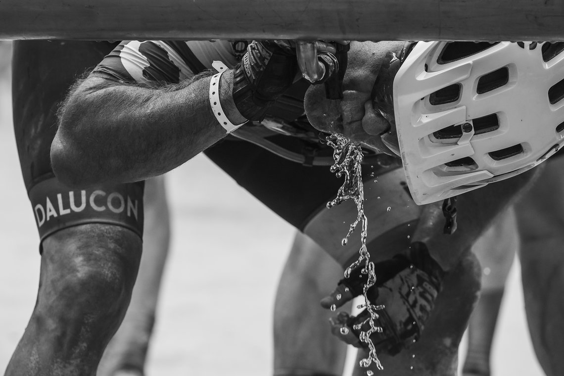 Rider enjoying some cool water during Stage 1 of the 2024 Absa Cape Epic Mountain Bike stage race from Saronsberg Wine Estate to Saronsberg Wine Estate, Tulbagh, South Africa on the 18th March 2024. Photo by Dominic Barnardt / Cape Epic
PLEASE ENSURE