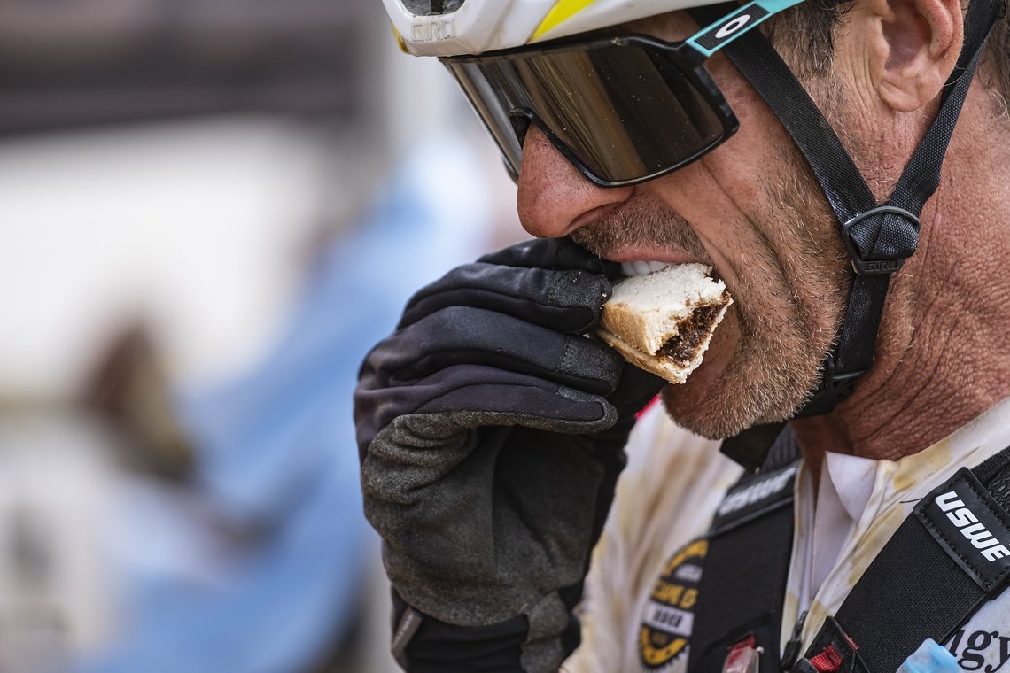 Rider has a Marmite sarnie during Stage 4 of the 2025 Absa Cape Epic Mountain Bike stage race held at Fairview, Paarl, Cape Town, South Africa on the 20th March 2025. Photo by Dom Barnardt/Cape Epic
PLEASE ENSURE THE APPROPRIATE CREDIT IS GIVEN TO TH