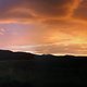 Blick vom Butterhübel zum Zittauer Gebirge nach einem regnerischen Sonnenuntergang
