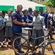 Bicycle handover Charles and girl student