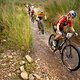 Pauline Ferrand Prevot of BMC MTB Racing leads Haley Batten of NinetyOne-Songo-Specialized while team mate Robyn de Groot follows during stage 4 of the 2022 Absa Cape Epic Mountain Bike stage race from Elandskloof in Greyton to Elandskloof in Greyton