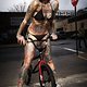 girl on bike with tattoos
