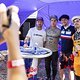 Loic Bruni, Brook MacDonald and Finn Iles are seen during athlete signing at Crankworx in Rotorua, New Zealand on March 21, 2019