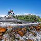 Riders cross the Berg River during stage 5 of the 2022 Absa Cape Epic Mountain Bike stage race from Elandskloof in Greyton to Stellenbosch, South Africa on the 25th March 2022 © Dom Barnardt / Cape Epic