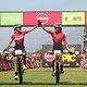 Maja Wloszczowska and Ariane Lüthi of Kross-Spur Racing celebrate finishing in third place during the final stage (stage 7) of the 2019 Absa Cape Epic Mountain Bike stage race from the University of Stellenbosch Sports Fields in Stellenbosch to Val d