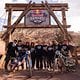 (left to right) Katie Holden, Robin Goomes, Georgia Astle, Casey Brown, Vero Sandler, Vinny Armstrong, Casey Kimball, Vea Verbeeck, and Michelle Parker pose at the finish corral at Red Bull Rampage in Virgin, Utah October 7th, 2024 // Emily Tidwell /