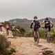 Rider pushing teammate up a climb during stage 3 of the 2019 Absa Cape Epic Mountain Bike stage race held from Oak Valley Estate in Elgin, South Africa on the 20th March 2019.

Photo by Xavier Briel/Cape Epic

PLEASE ENSURE THE APPROPRIATE CREDIT