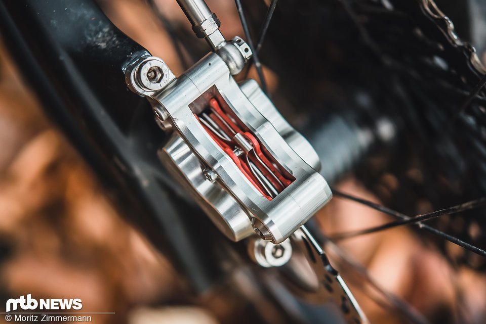 Man adjusting brakes with little space